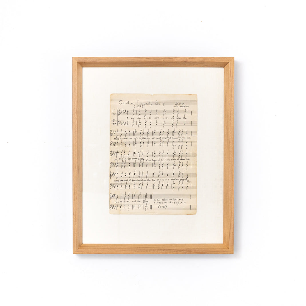 sheet music framed in cherry frame with white sides and a white mat