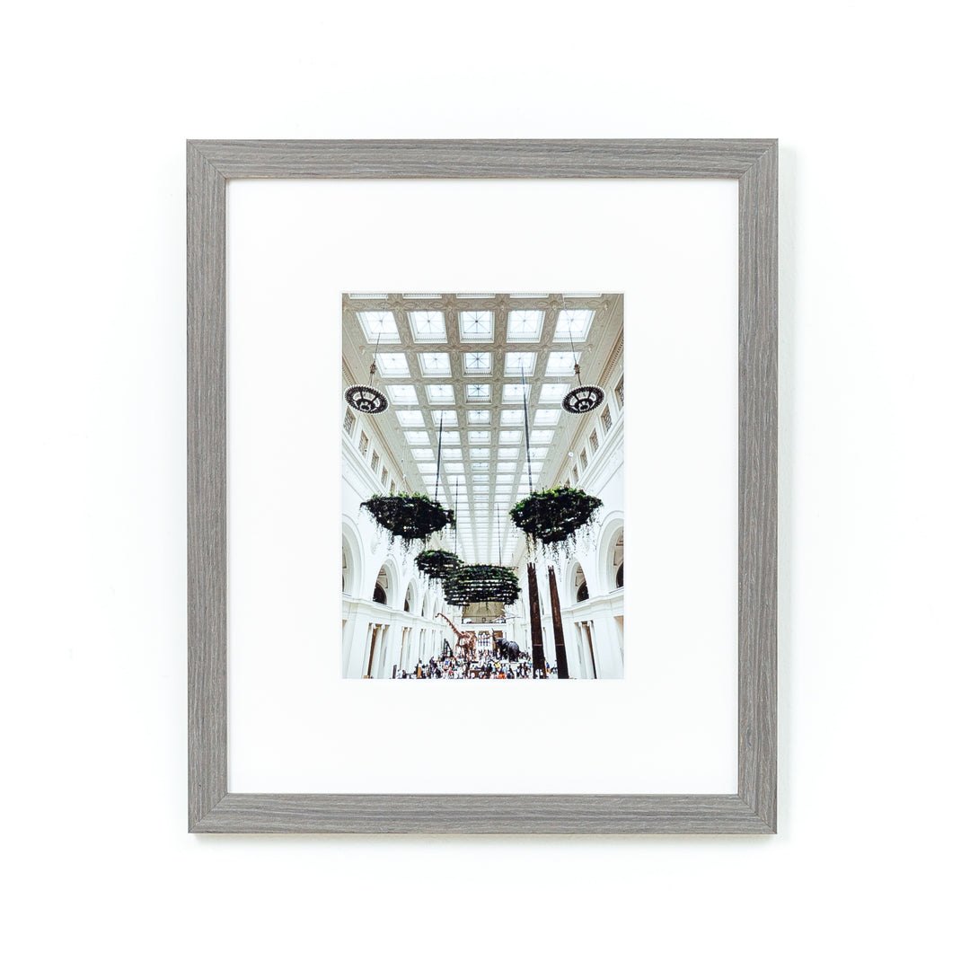 architectural photo of a museum ceiling framed in gray Everett frame with a white mat