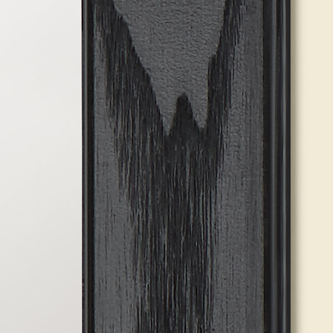 Closeup of a dog portrait painting in a black ash angled frame