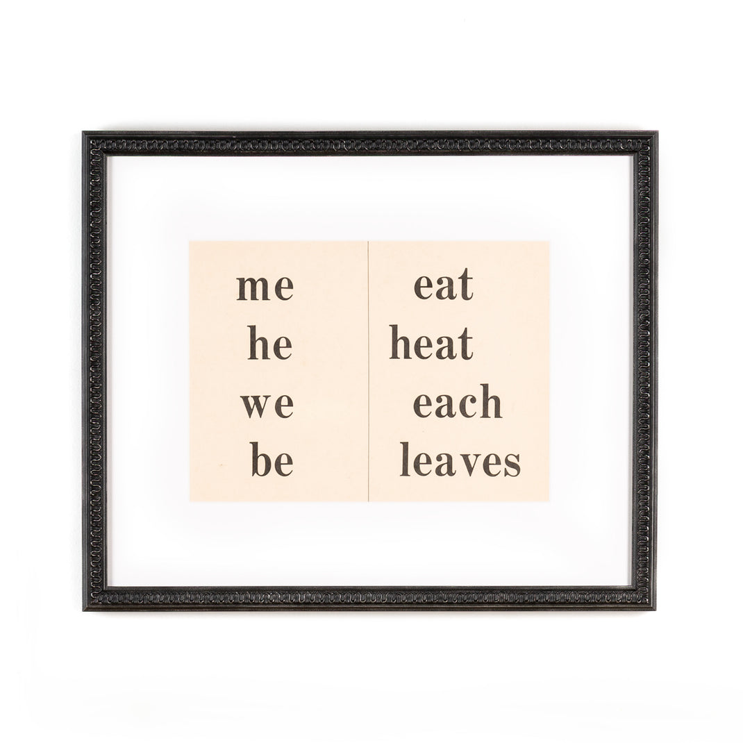 pages of a sight words book framed in wavy matte black Gresham frame with white mat