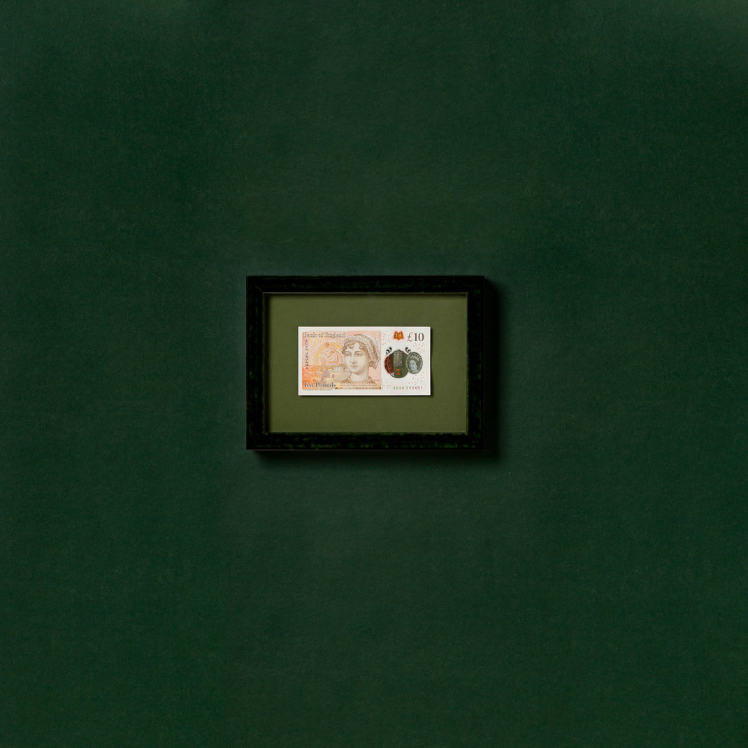 framed English currency in London green glazed frame with a green mat