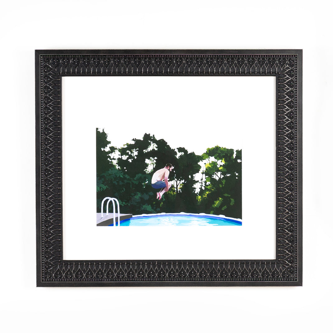 art print of a man doing a cannonball into a pool framed in ornate black Ravenswood frame with a white mat